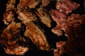 Miguel is a professional chef now grilling lamb chops.
