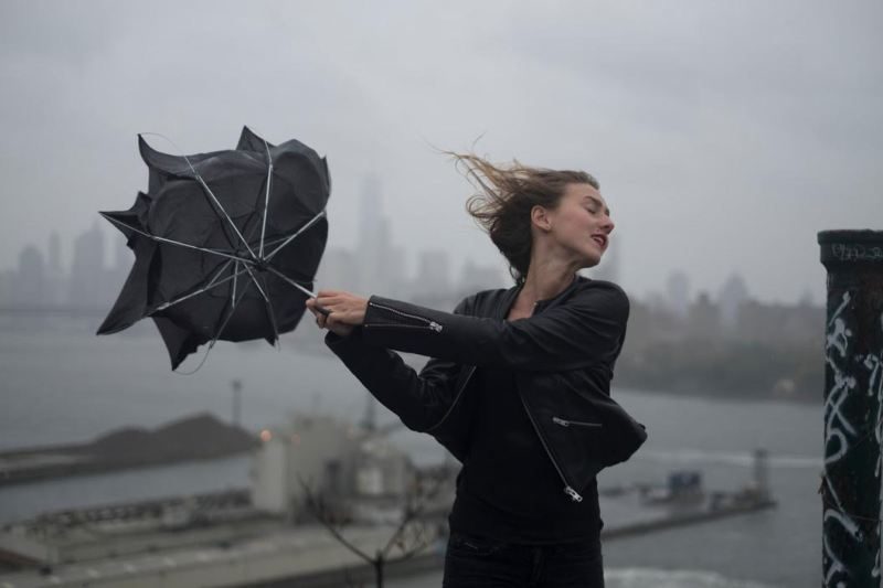 USA. Brooklyn, NY. 2015. Dasha Gavrylenko goes up on the roof of the 'kibbutz' appartment building to watch hurricane Joaquin.